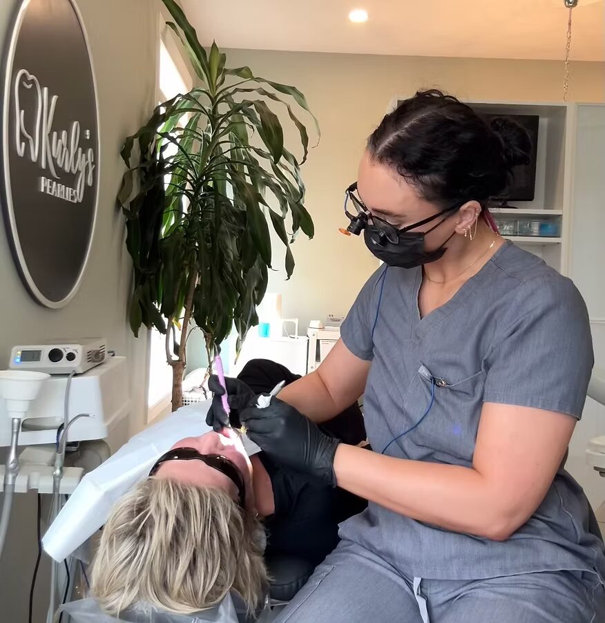 Dental hygiene cleaning in a heated massage chair at Kurly's Pearlies in Georgetown, Ontario